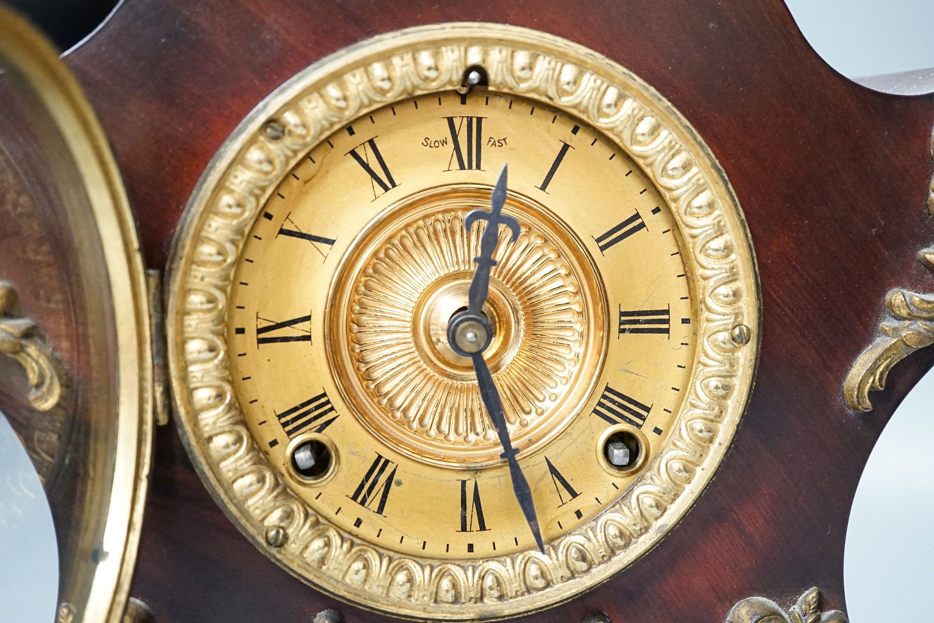 A late 19th century American brass mounted mahogany mantel clock, height 27cm